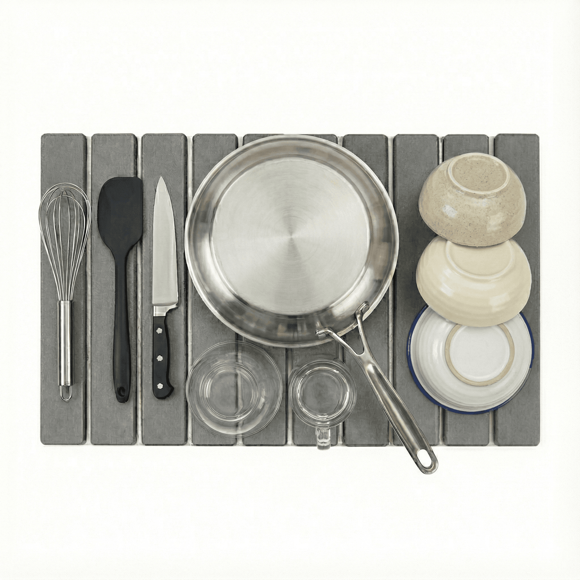 Trivelle stone drying mat alongside kitchen cookware